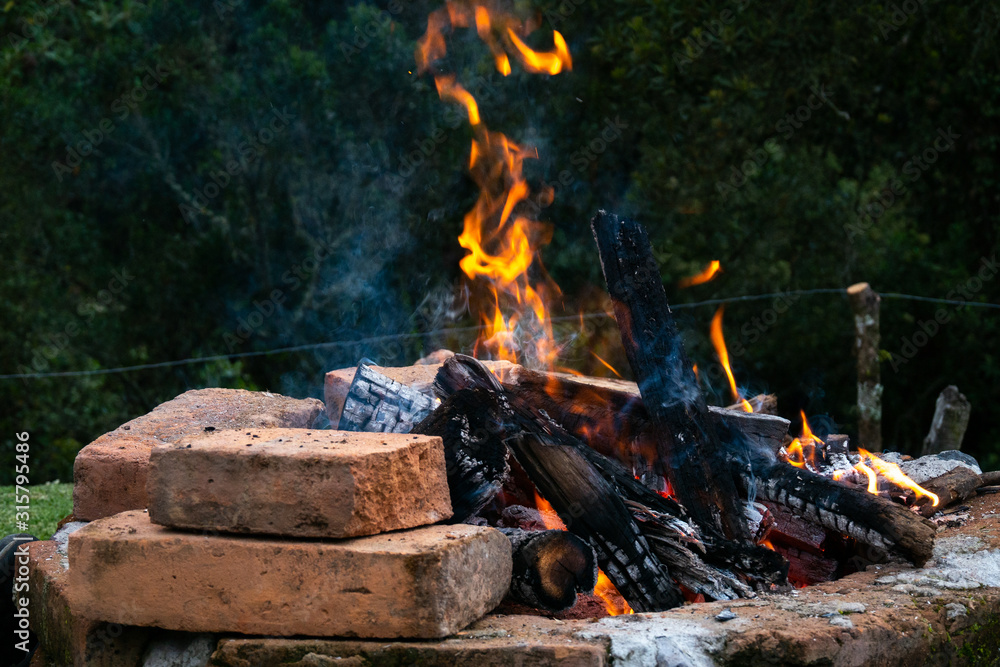 large bonfire on bricks to prepare the grill large bonfire on bricks to prepare the grill
