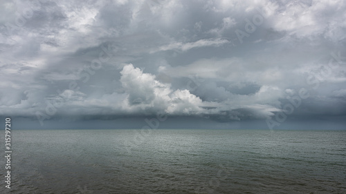 Storm brewing on the horizon over the ocean at Bramston Beach, North Queensland