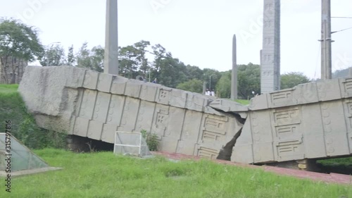 Panoramic pan right side view of entire fallen Great Stele Number 1 at the Northern Stelae Field in Aksum, Ethiopia