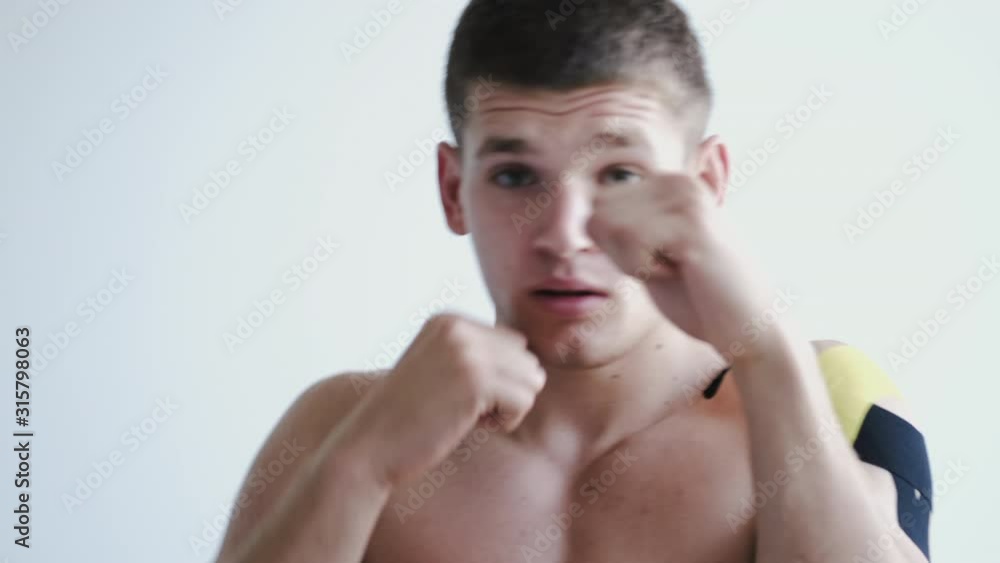 A man is a boxer. He has an injury. The athlete is treated in the clinic. A man is a boxer. He has an injury. The athlete is treated in the clinic.