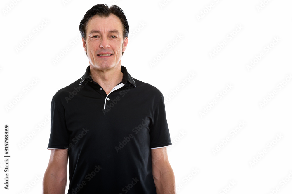 Studio shot of happy mature handsome man smiling Studio shot of happy mature handsome man smiling