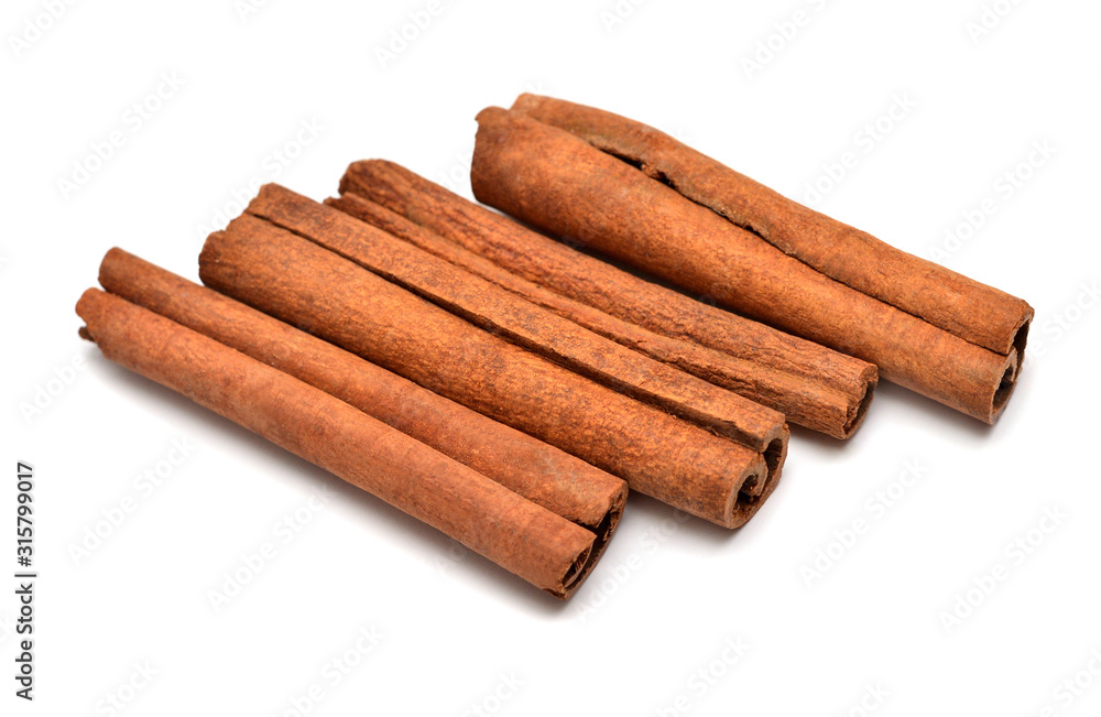 Cinnamon sticks isolated on a white background. Perfectly retouched, full depth of field on the photo. Top view, flat lay Cinnamon sticks isolated on a white background. Perfectly retouched, full depth of field on the photo. Top view, flat lay