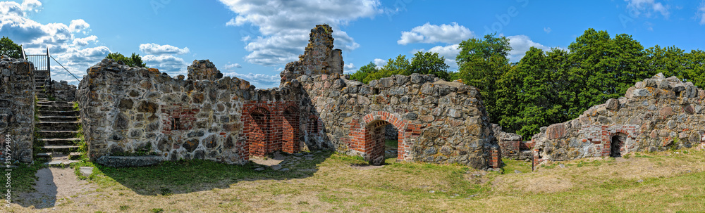 Ruins of the medieval Bishop’s Castle on the island of Kuusisto in Kaarina, Finland, near Turku, at sunny summer day.