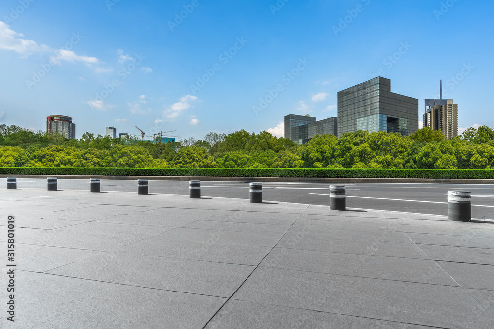 Panoramic skyline and buildings with empty square floor.