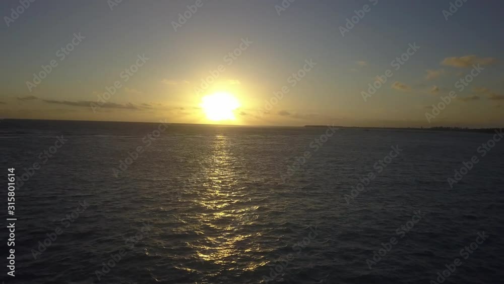 Aerial view of sunrise in the sea. Calm view of yachts and waves with transparent water in the ocean. Aerial panoramic view of sunset over ocean. Nothing but sky, ocean, waves, and boats Aerial view of sunrise in the sea. Calm view of yachts and waves with transparent water in the ocean. Aerial panoramic view of sunset over ocean. Nothing but sky, ocean, waves, and boats