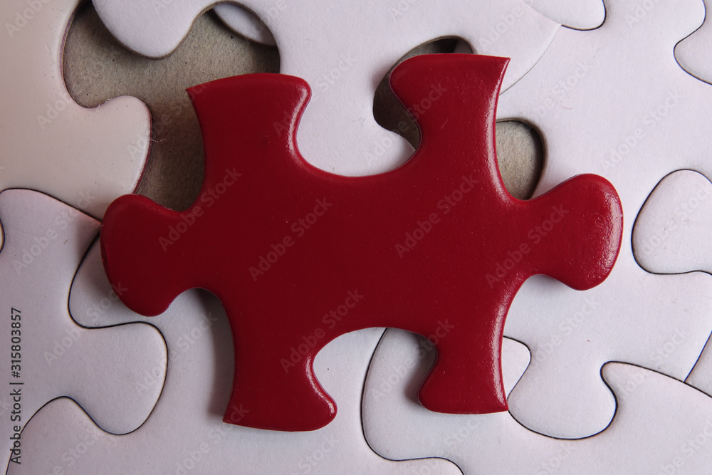 Red puzzle on white background. Copy space