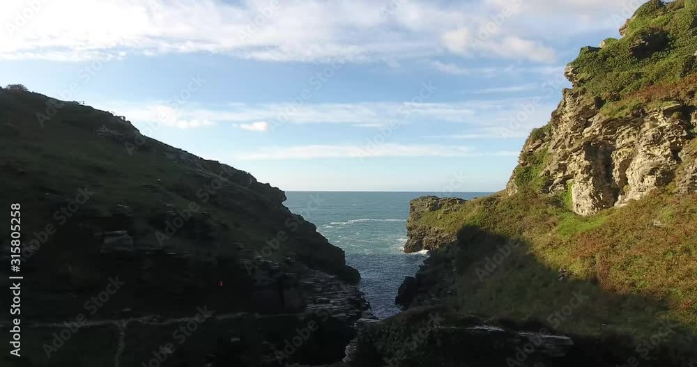 a rocky river valley in north cornwall leading to the atlantic ocean. a rocky river valley in north cornwall leading to the atlantic ocean.