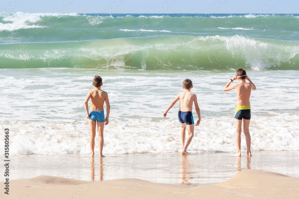 Children on the background of the sea