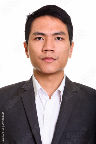 Face of young Asian businessman in suit