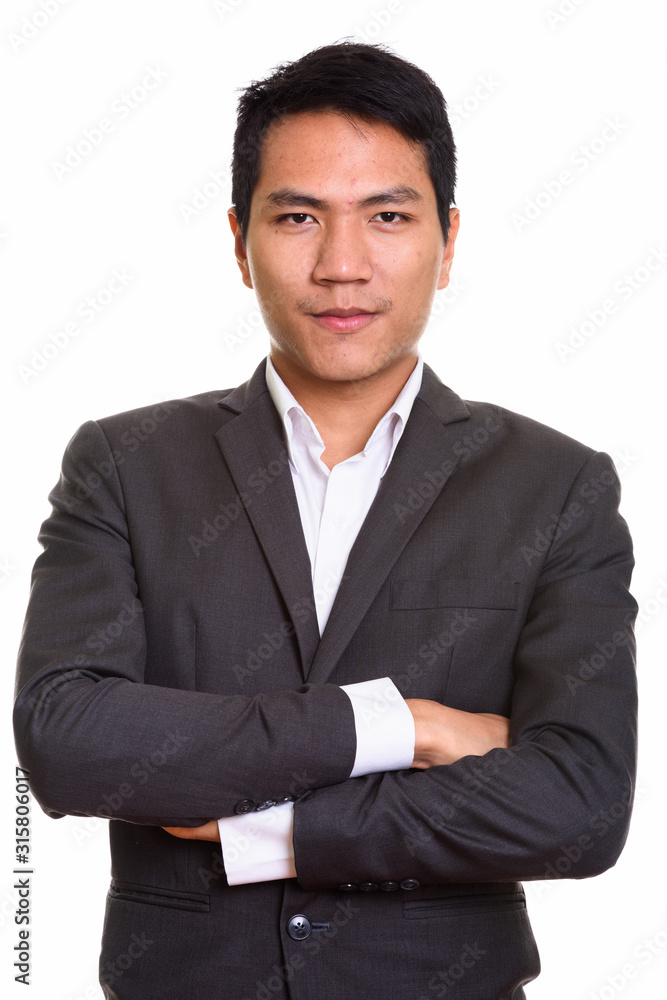 Close up of young Asian businessman with arms crossed Close up of young Asian businessman with arms crossed