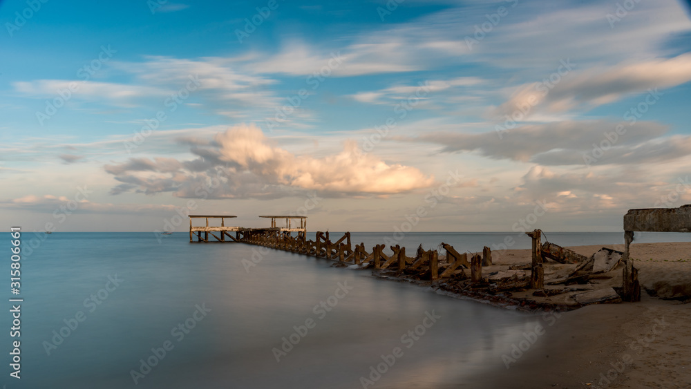 Dilapidated old fishing dock collapsing into the sea in Pak Nam Pran Thailand Dilapidated old fishing dock collapsing into the sea in Pak Nam Pran Thailand