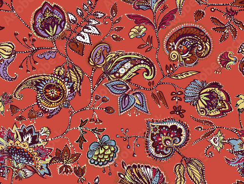 Decorative seamless floral pattern for fabric, tapestry, wallpaper and backgrounds in the style of a traditional oriental paisley pattern.