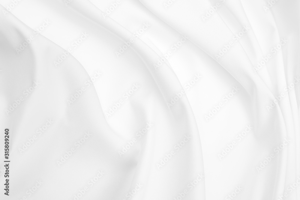 Abstract white fabric texture background. Cloth soft wave. Creases of satin, silk, and cotton.	