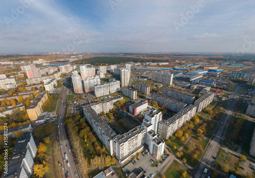 Aerial view of Ekaterinburg city. District of the city - Elmash. Autumn, sunny. Yellow leaves on trees © flyural66