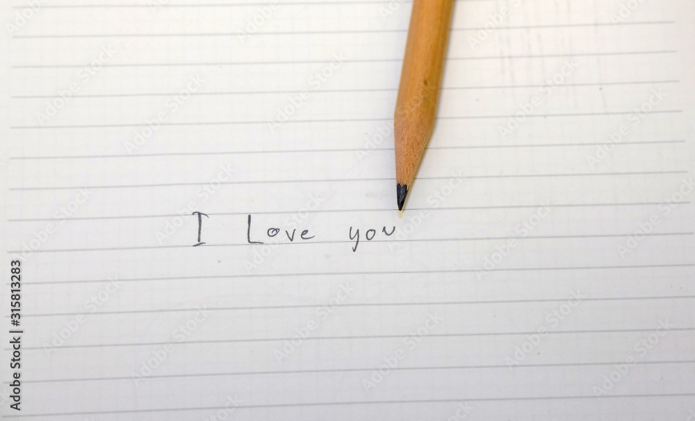 I love you message in a notebook written with pencil I love you message in a notebook written with pencil