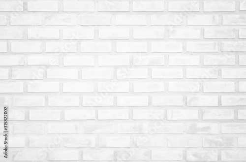 White brick wall texture background in room at subway. Brickwork stonework interior, rock old clean concrete grid uneven abstract weathered bricks tile design, horizontal architecture wallpaper.