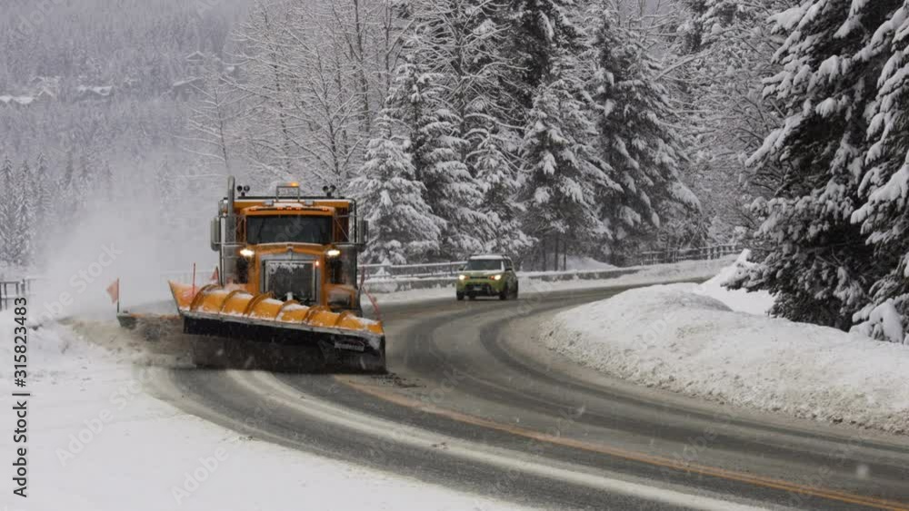 Truck Plowing Snow On A Highway Truck Plowing Snow On A Highway