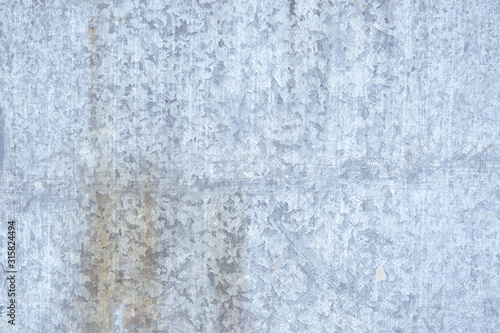 galvanized metal texture with old peeling paint. Metal background, copyspace. view from above © Georgii