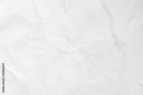 White recycled craft paper texture as background. Grey paper texture, Old vintage page or grunge vignette of old newspaper. Pattern rough art creased grunge letter. Hardboard with copy space for text. photo