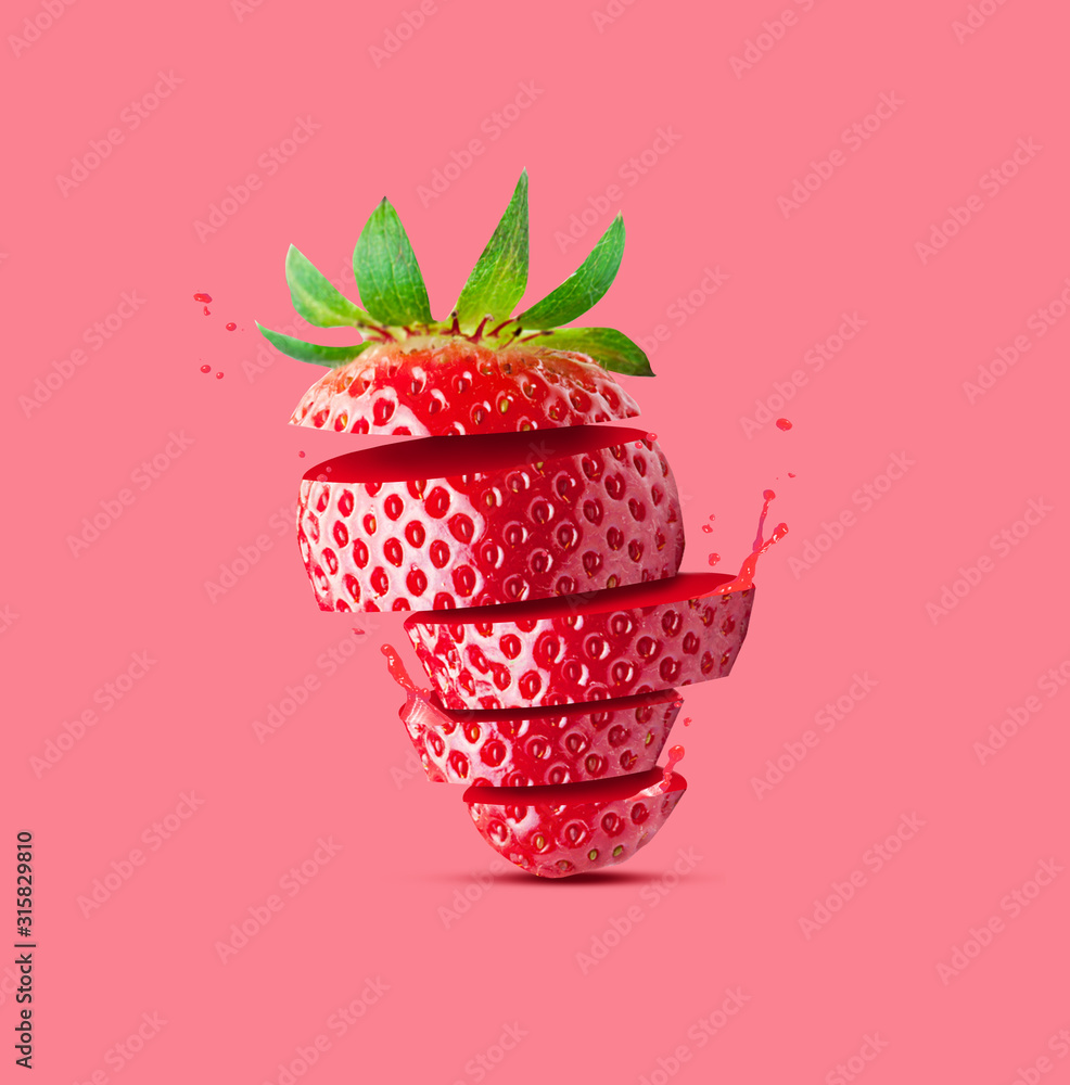 Creative concept with flying Strawberry. Sliced orange pink background