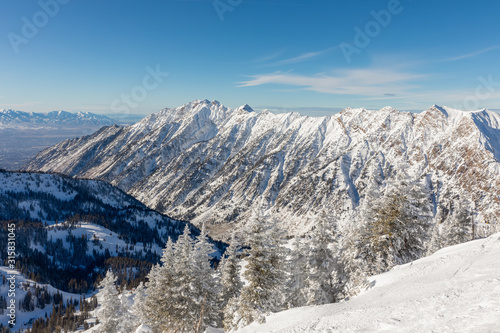 Mountains and skyline viewed from Hidden Peak at Snowbird in Little Cottonwood Canyon in the Wasatch Range near Salt Lake City, Utah, USA. photo