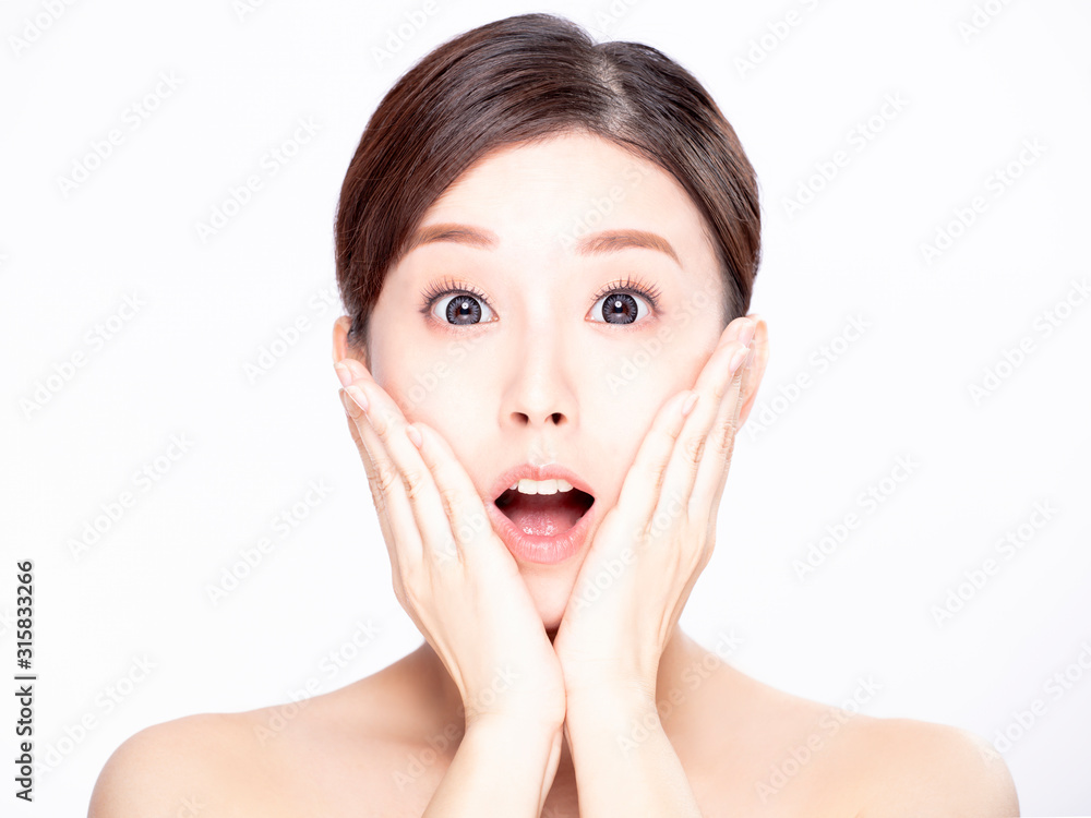 closeup young surprised woman with clean fresh skin closeup young surprised woman with clean fresh skin