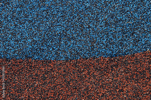 rubberised ground cover surface texture with blue and red colour