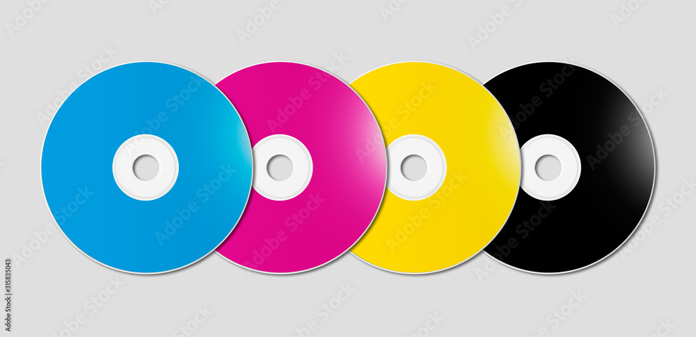 CMYK CD - DVD set on grey background CMYK CD - DVD set on grey background
