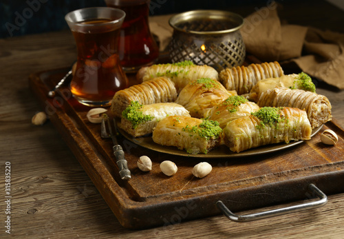 traditional oriental sweets baklava with nuts photo