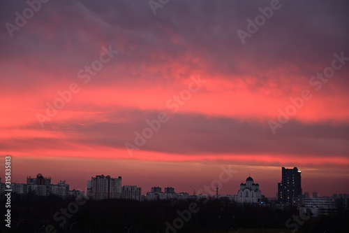 Photo of gloomy sky colororg over the city in the morning © Вячеслав Чичаев