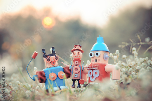 Assemblage robot family sculptures in the lawn