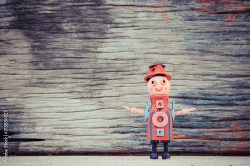 Assemblage robot sculptures ,wood background