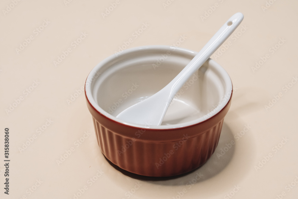 Close-up view of single empty white bowl ready for breakfast Close-up view of single empty white bowl ready for breakfast