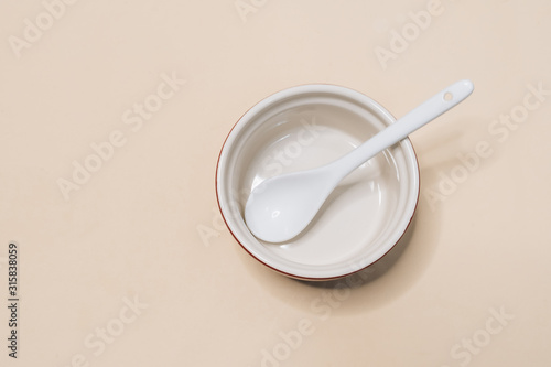 Close-up view of single empty white bowl ready for breakfast