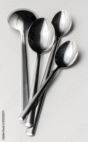 Set of silver cutlery on a white background