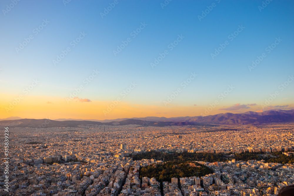 Sunset in Athens on a cloudy sky with a city view from Lycabettus hill