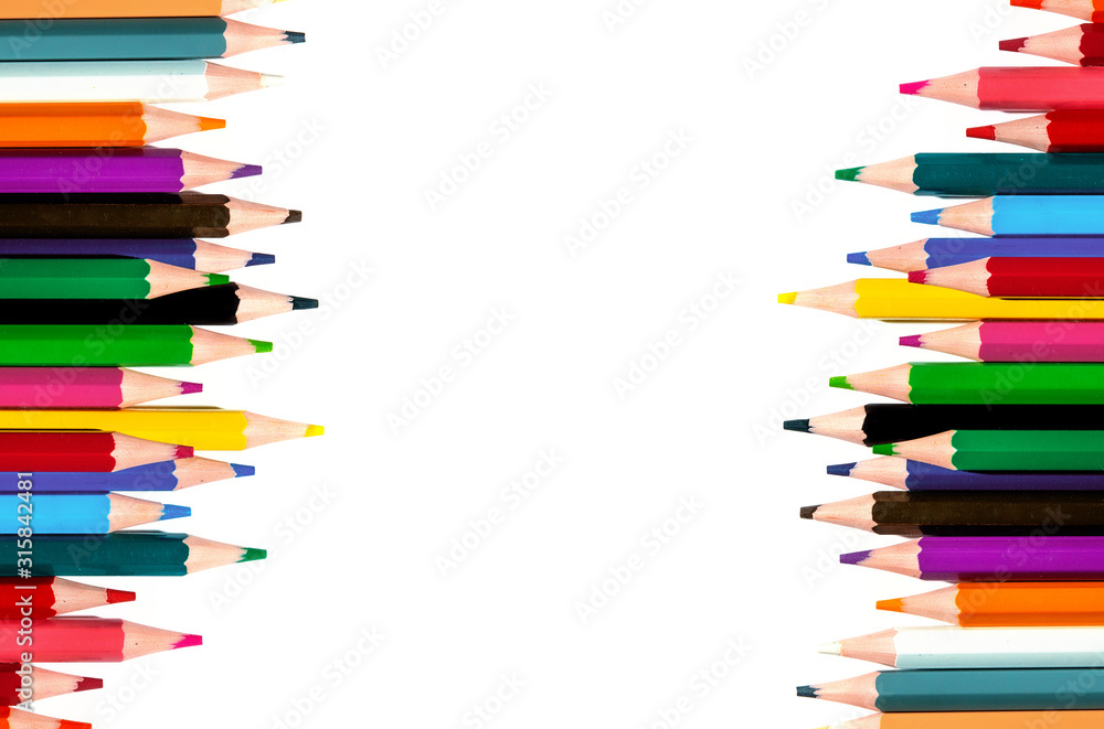 multicolored pencils on a white background. top view. multicolored pencils on a white background. top view.