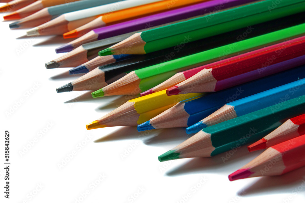 multicolored pencils on a white background. multicolored pencils on a white background.