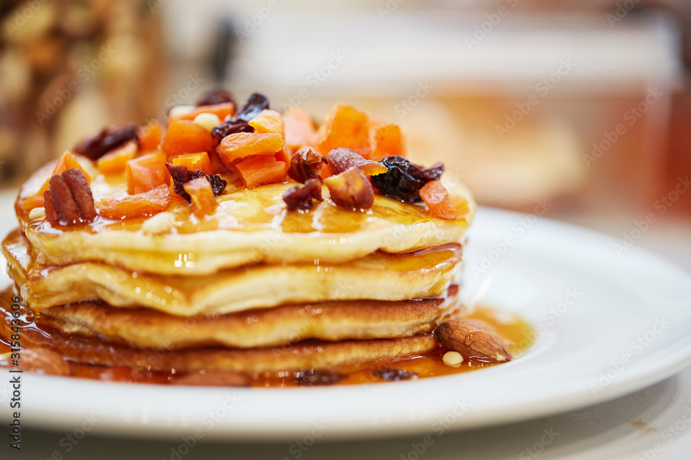 pancakes with nuts, honey and dried apricots pancakes with nuts, honey and dried apricots