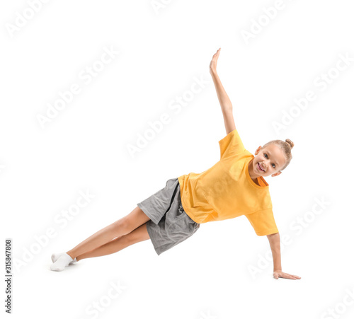 Little girl practicing yoga...