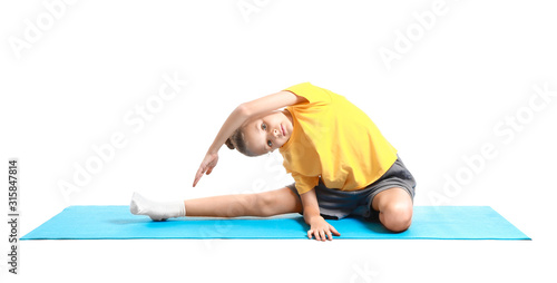 Little girl practicing yoga...