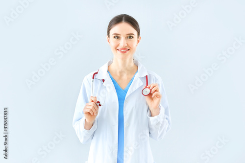 Portrait of female doctor w...