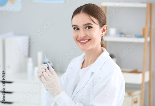 Doctor with syringe in clinic