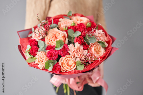 Wallpaper Mural European floral shop. Beautiful bouquet of mixed flowers in womans hands. the work of the florist at a flower shop. Delivery fresh cut flower. Torontodigital.ca