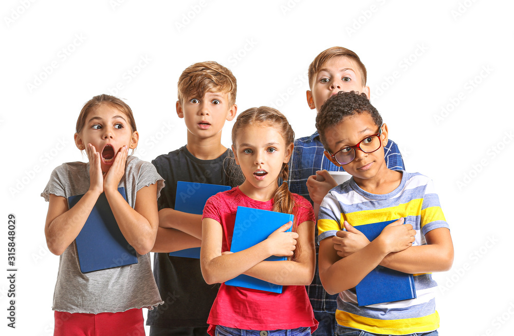 Surprised little children with books on white background Surprised little children with books on white background