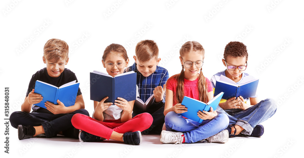 Cute little children reading books on white background Cute little children reading books on white background