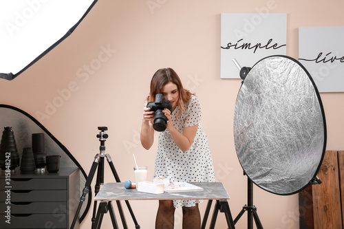 Young woman taking picture ...