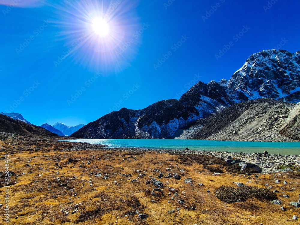 Dudh Pokhari, the third Gokyo lake. Everest base camp trek itinerary: from Machhermo to Gokyo. Beautiful views of autumn hills, snowy mountains and turquoise lakes.