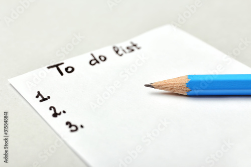 Empty to do list with pencil on white background, closeup
