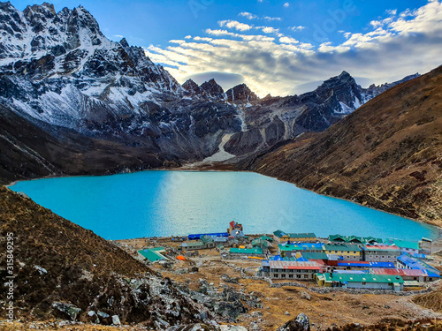 Everest base camp trek itinerary: Gokyo village, Solokhumbu, Nepal. Picturesque view on famous Dudh Pokhari or Gokyo lake with marvellous turquoise water. photo